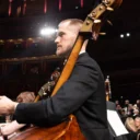 An RPO double bassist on stage looking out to the audience just before a concert at the Royal Albert Hall.