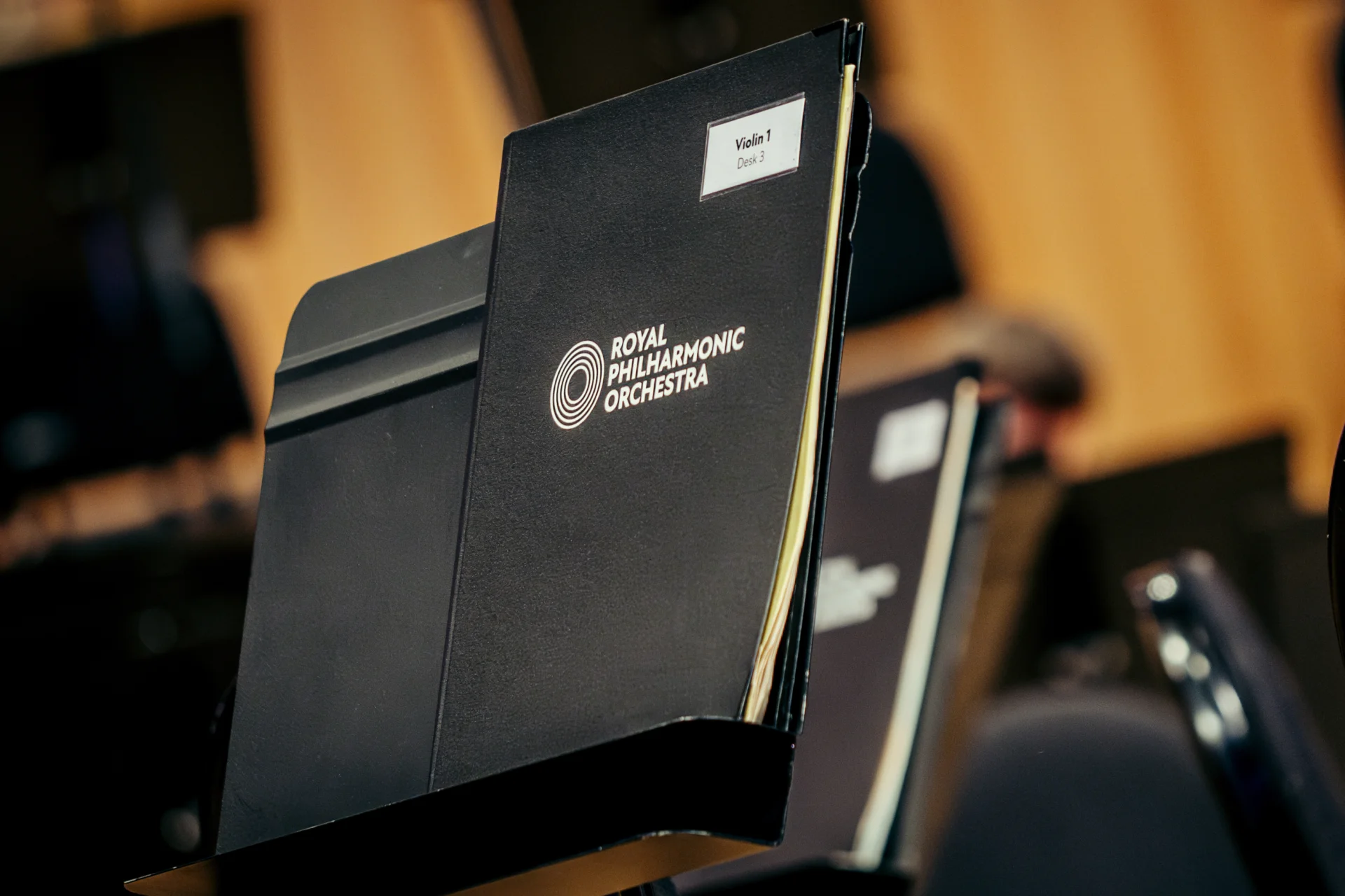 An RPO-branded folder on a music stand
