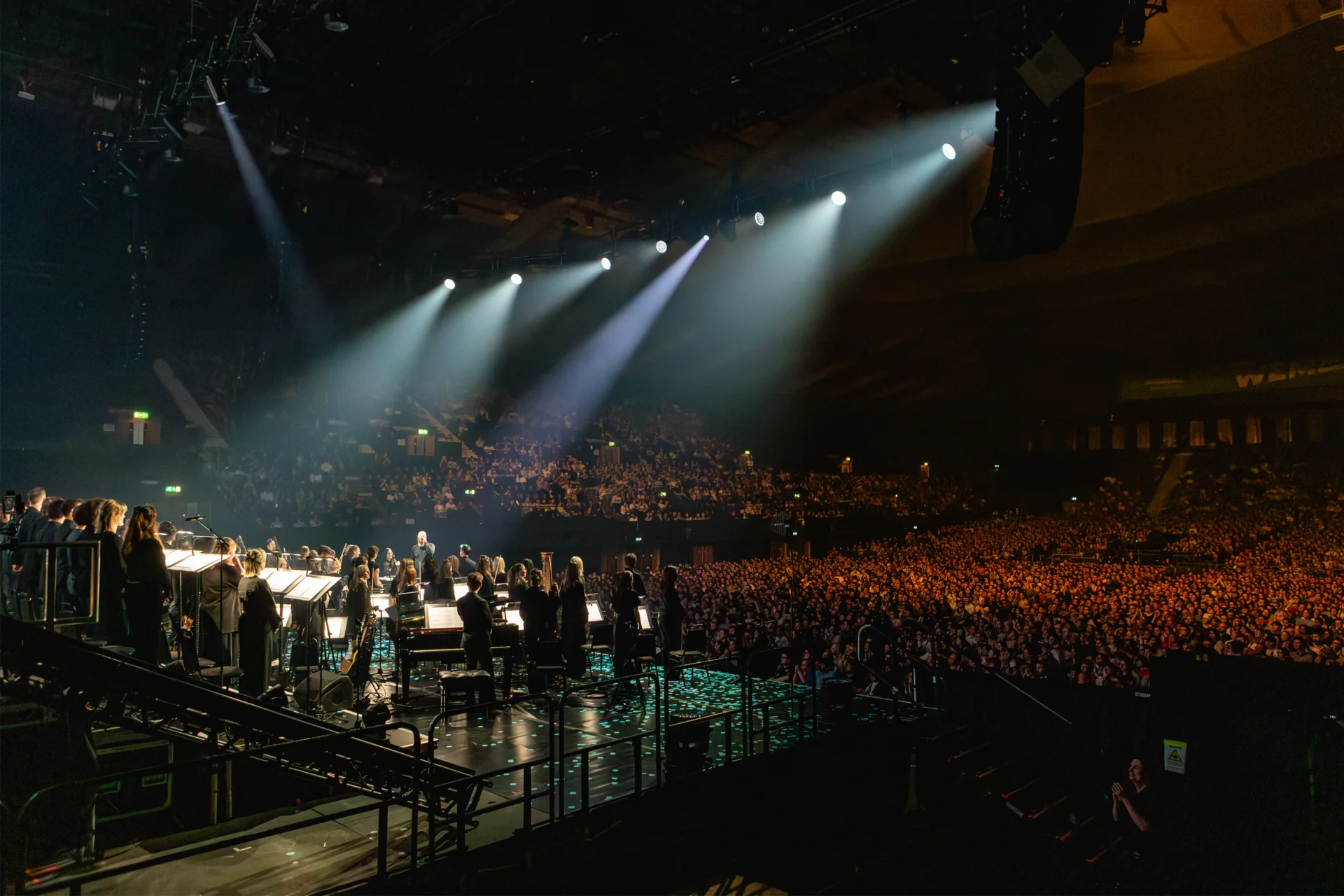 The Royal Philharmonic Concert Orchestra standing for applause at the OVO Arena in Wembley