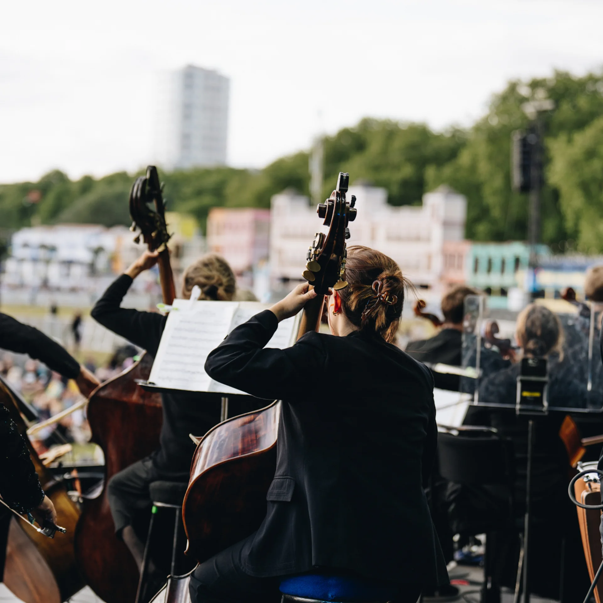 RPCO double bass players on an outdoor stage in Hyde Park