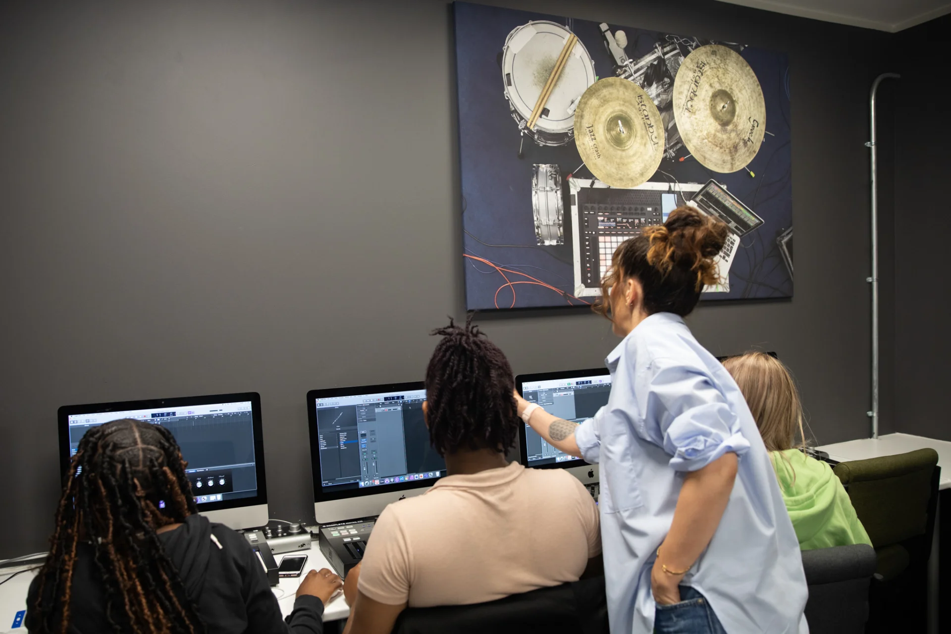 Brent Music Academy participants working at computers.