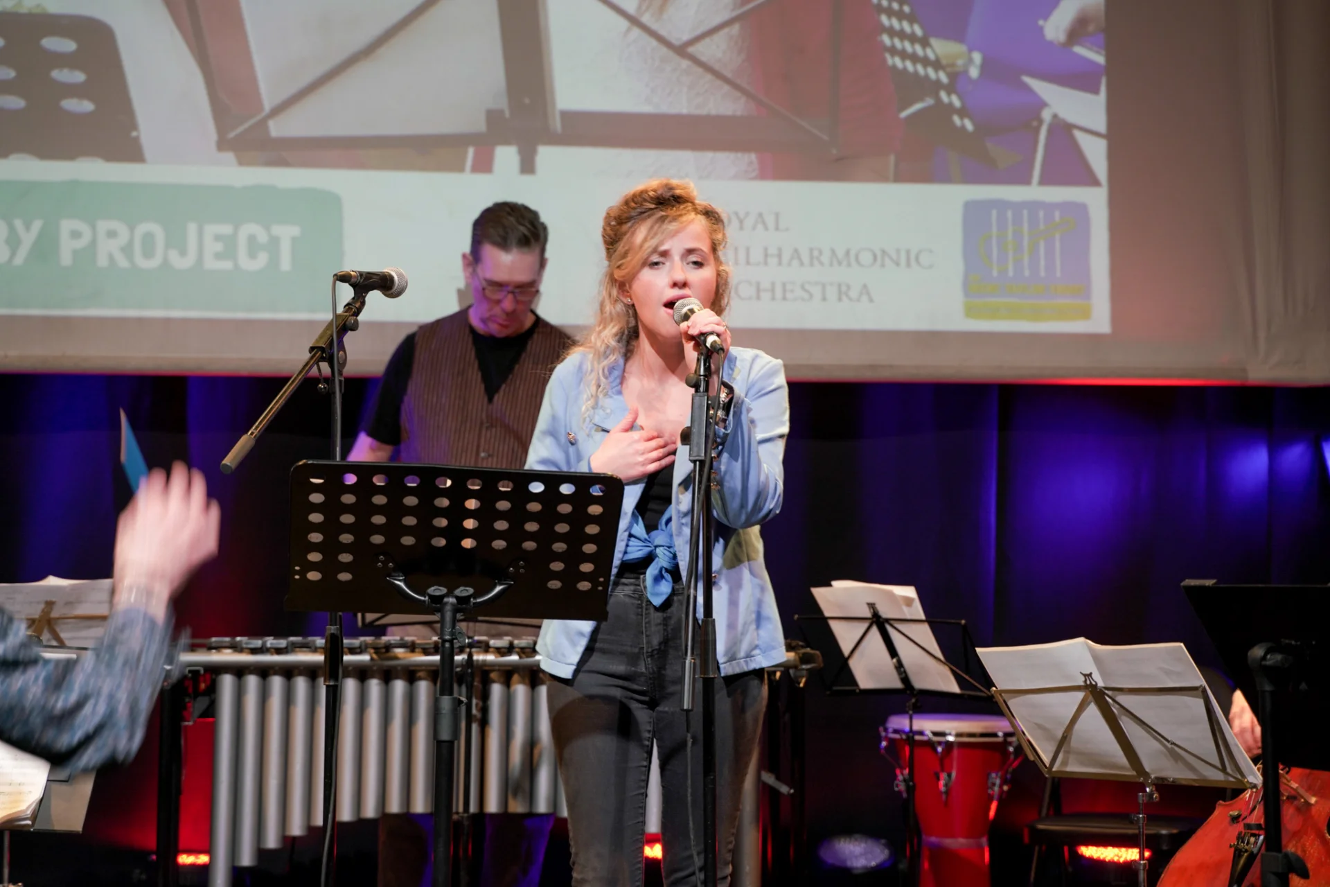 Vocalist on stage at Lullaby Project.