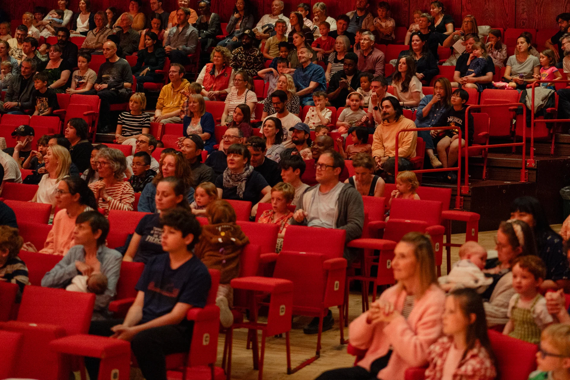 Audience members watching a Noisy Kids concert