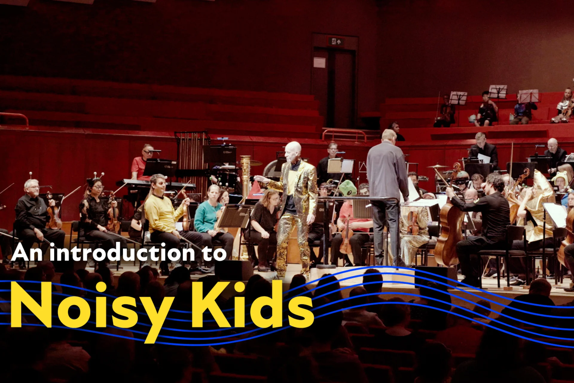 A Noisy Kids concert at Reading's The Hexagon with the text 'An introduction to Noisy Kids' overlaid