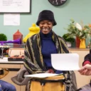 Sound Sanctuary Participant and RPO musician smiling during group discussion.
