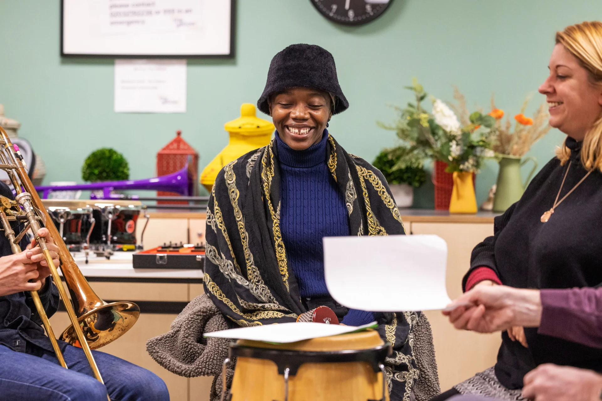 Sound Sanctuary Participant and RPO musician smiling during group discussion.