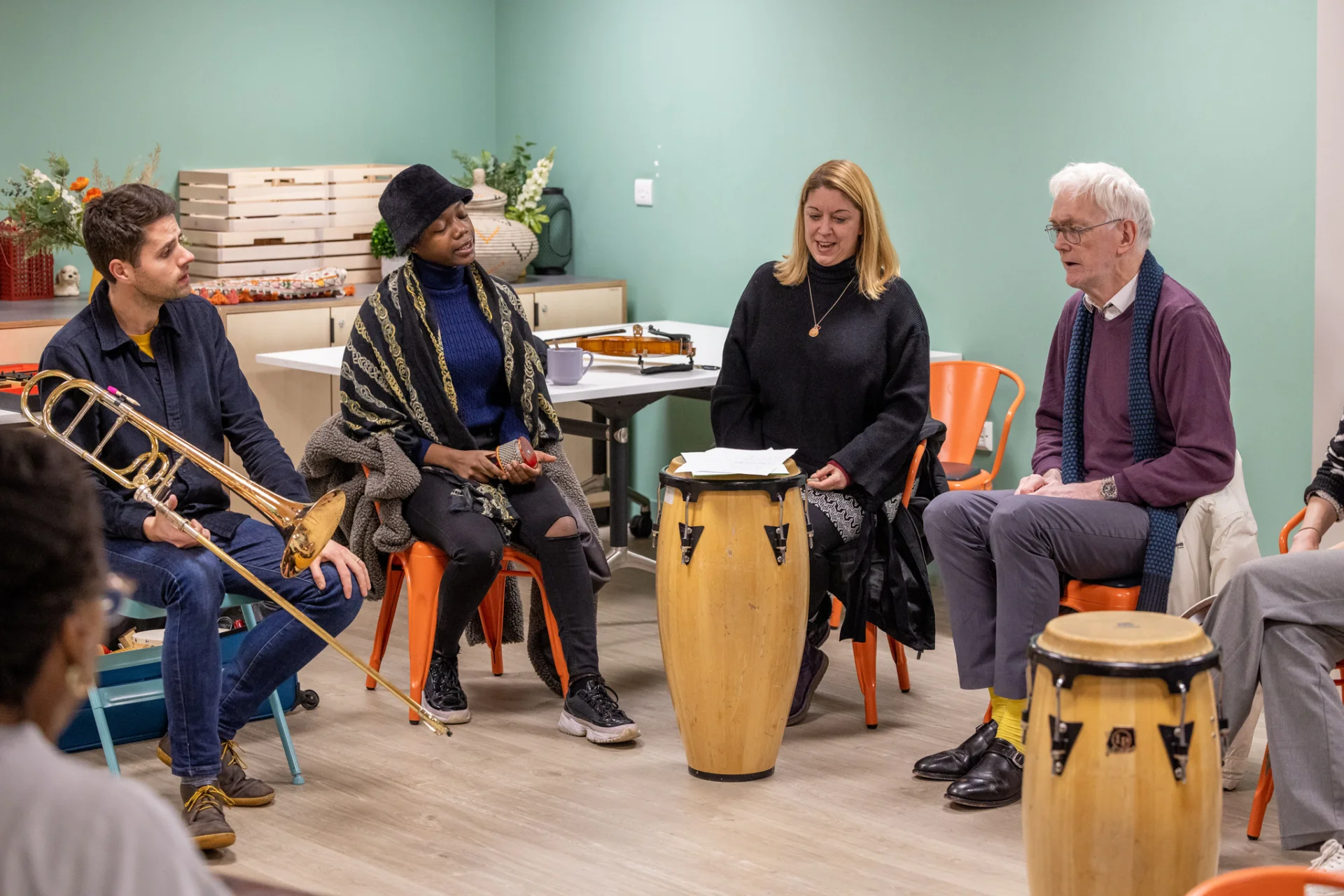 Sound Sanctuary participants and RPO musicians playing instruments together.