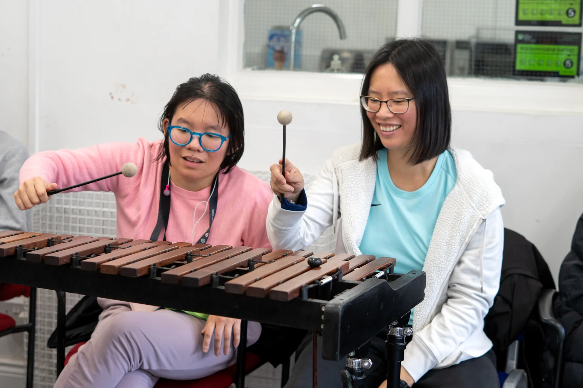 Sound Sanctuary participants playing a xylophone.
