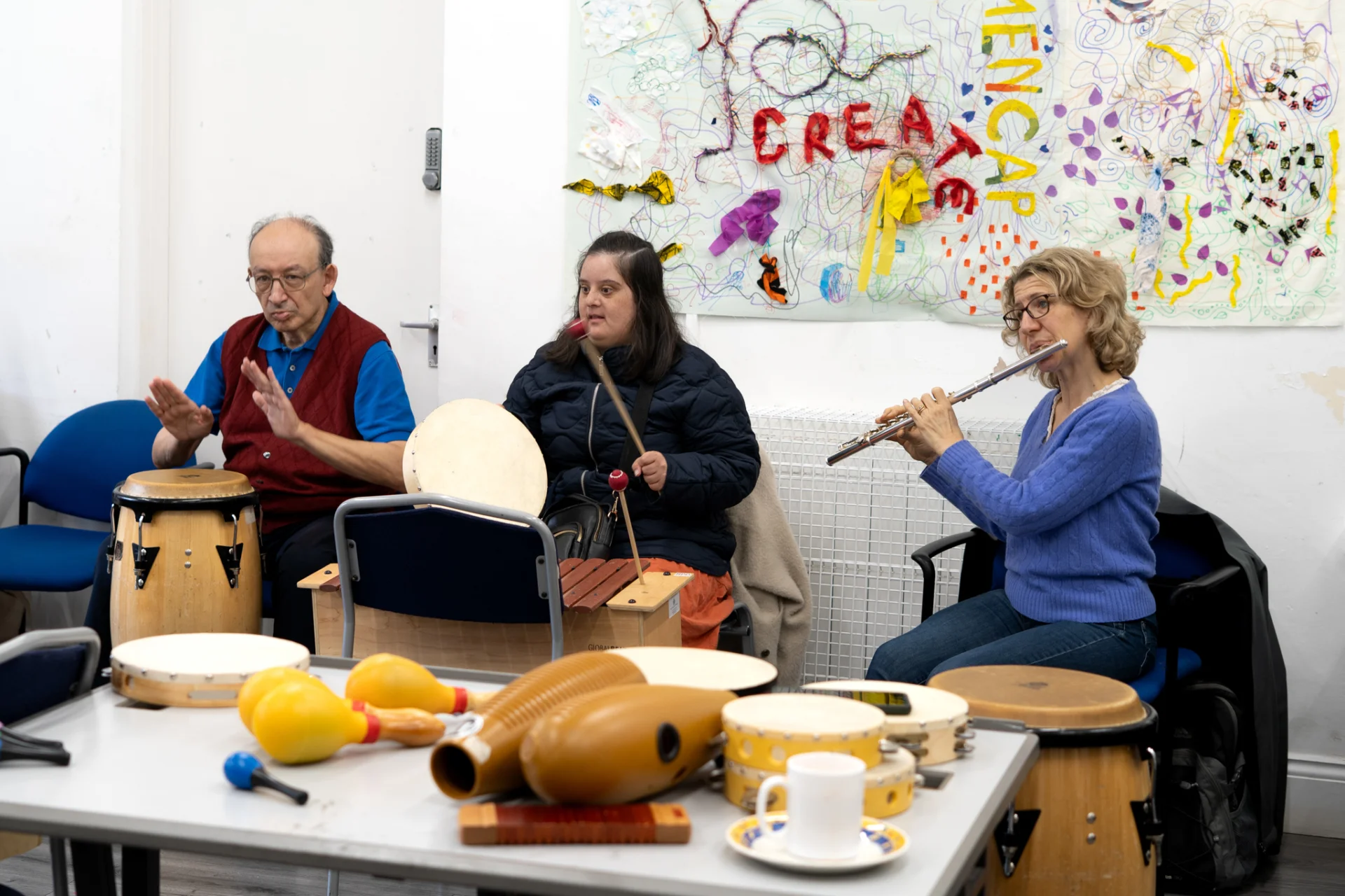 Sound sanctuary participants playing instruments at Brent Mencap.