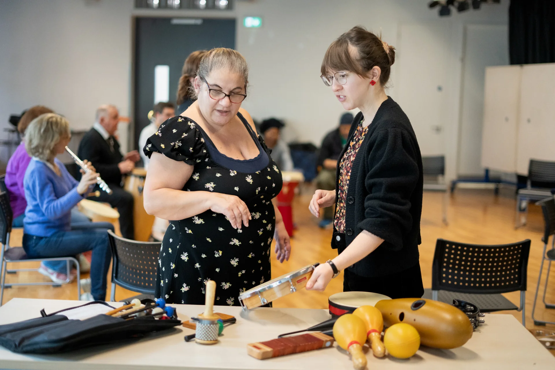 Participant and RPO Resound team member discussing instruments.