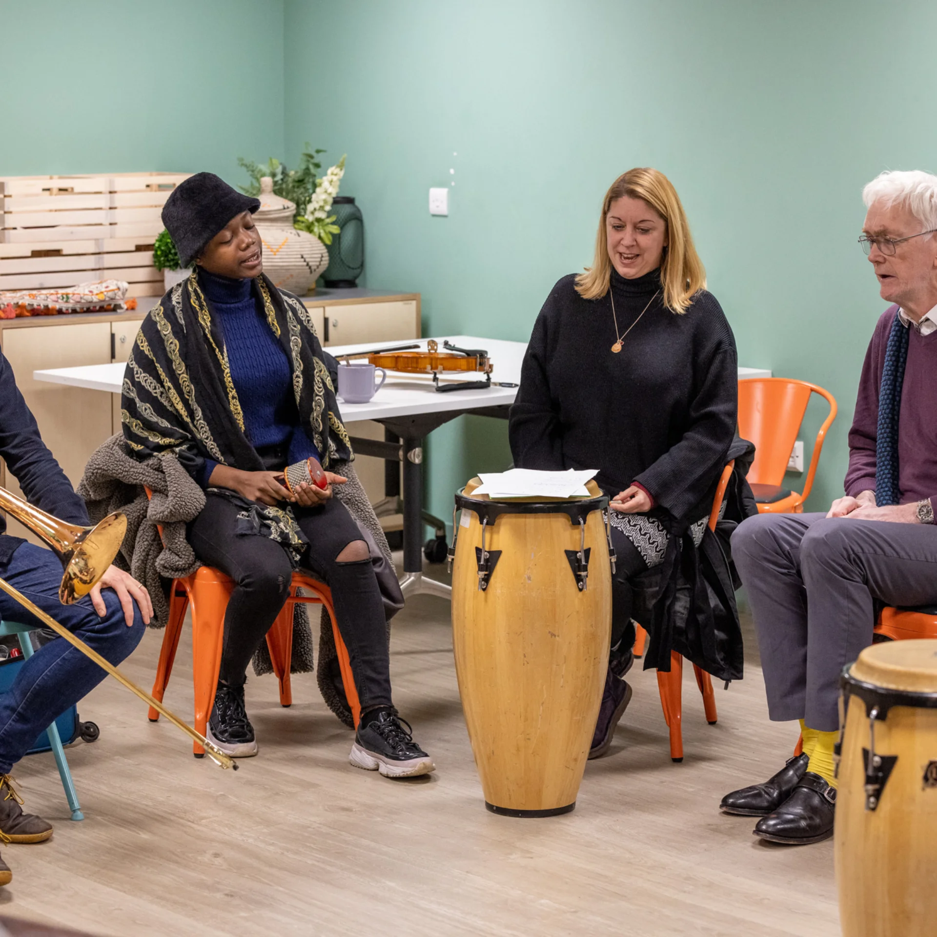Sound Sanctuary participants and RPO musicians playing instruments together.