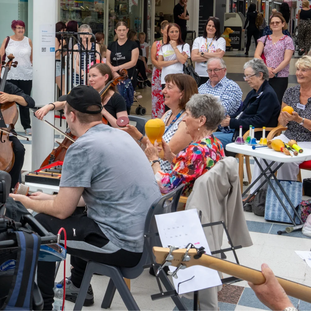 RPO players with stroke patients and their carers playing in a shopping centre in Hull