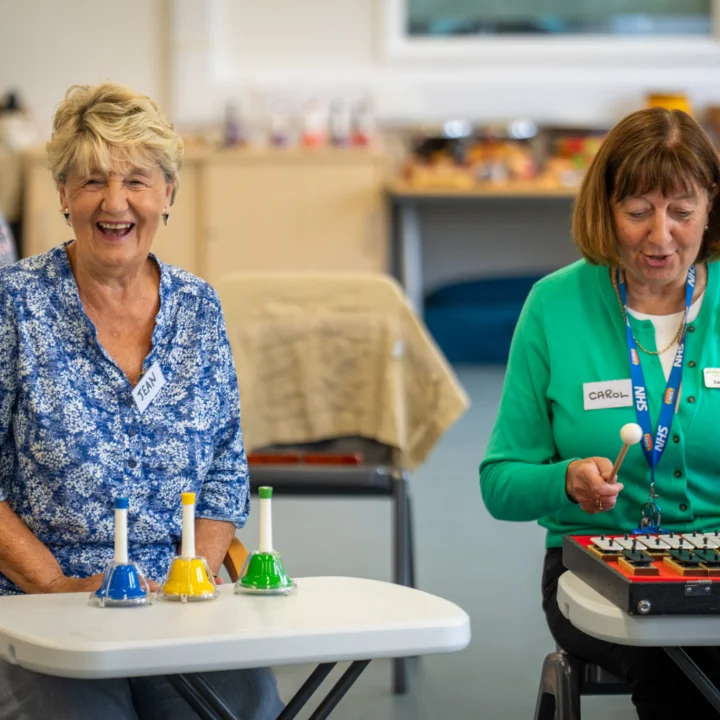 STROKESTRA participants playing instruments during a workshop.