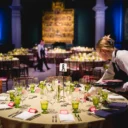 Tables being set for dinner in the Raphael Court for the RPO's 80th Anniversary Gala.