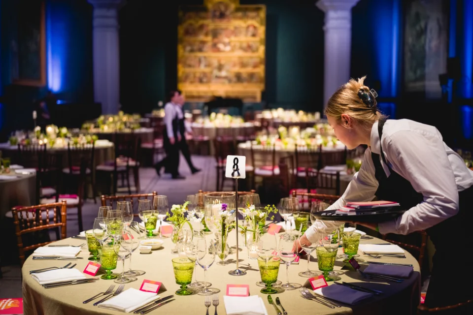 Tables being set for dinner in the Raphael Court for the RPO's 80th Anniversary Gala.