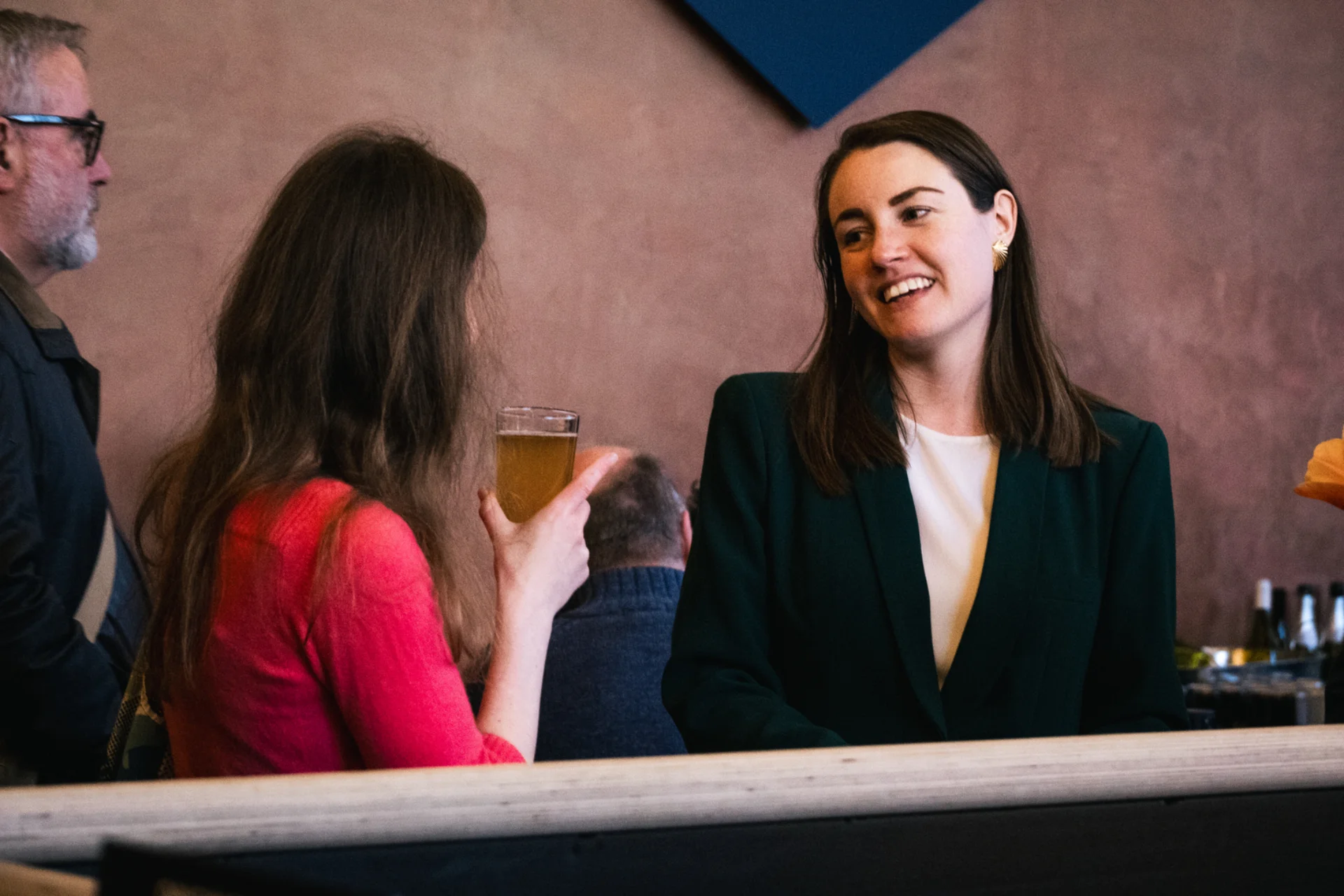 Two RPO young patrons smiling at each other during an Insights event.