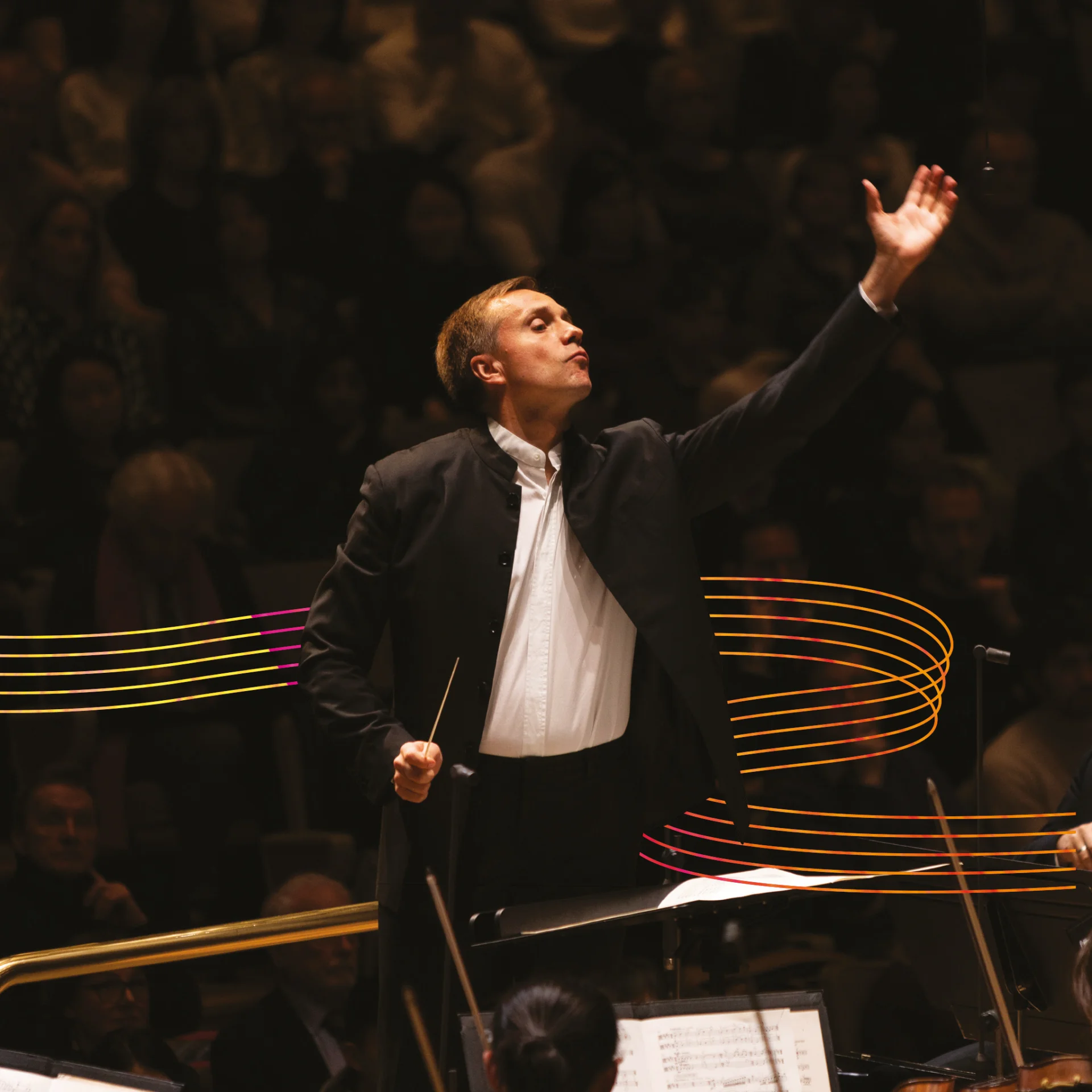 Vasily Petrekno conducting the Orchestra with yellow musical stave illustration behind him