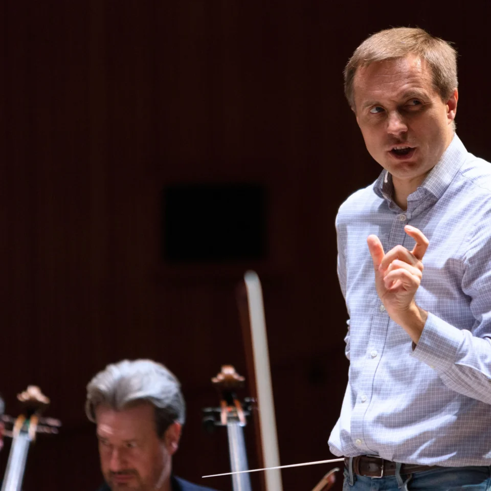 Vasily Petrenko on stage with the Orchestra, speaking about the repertoire to the audience