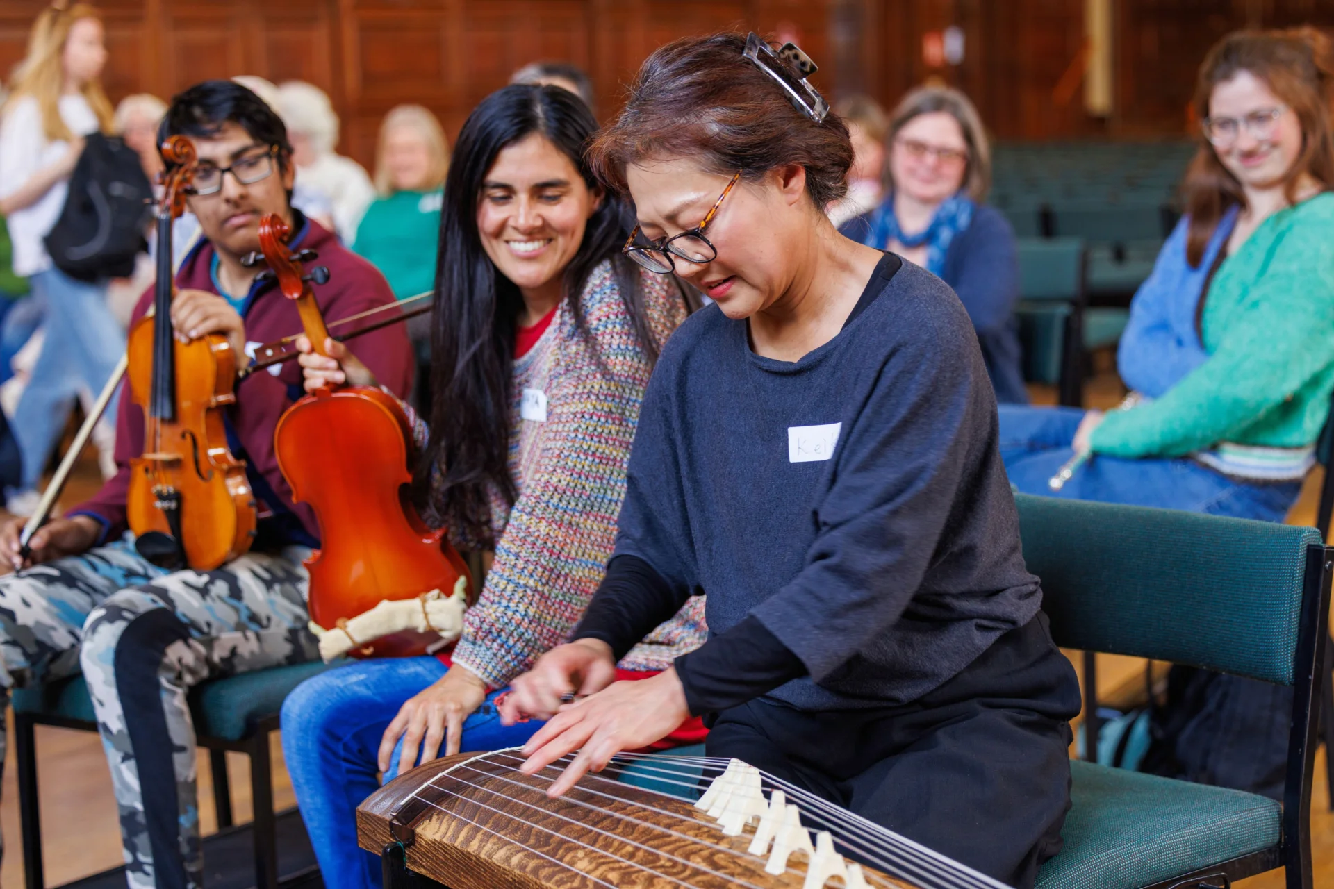 Participants in a Resound workshop play an instrument together