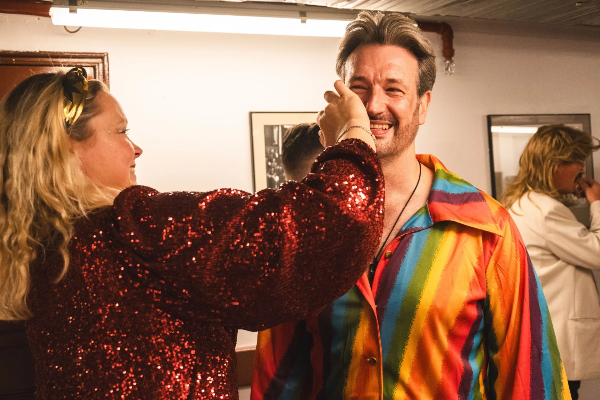 RPO musicians put glitter on their cheeks in preparation for an ABBAphonic concert