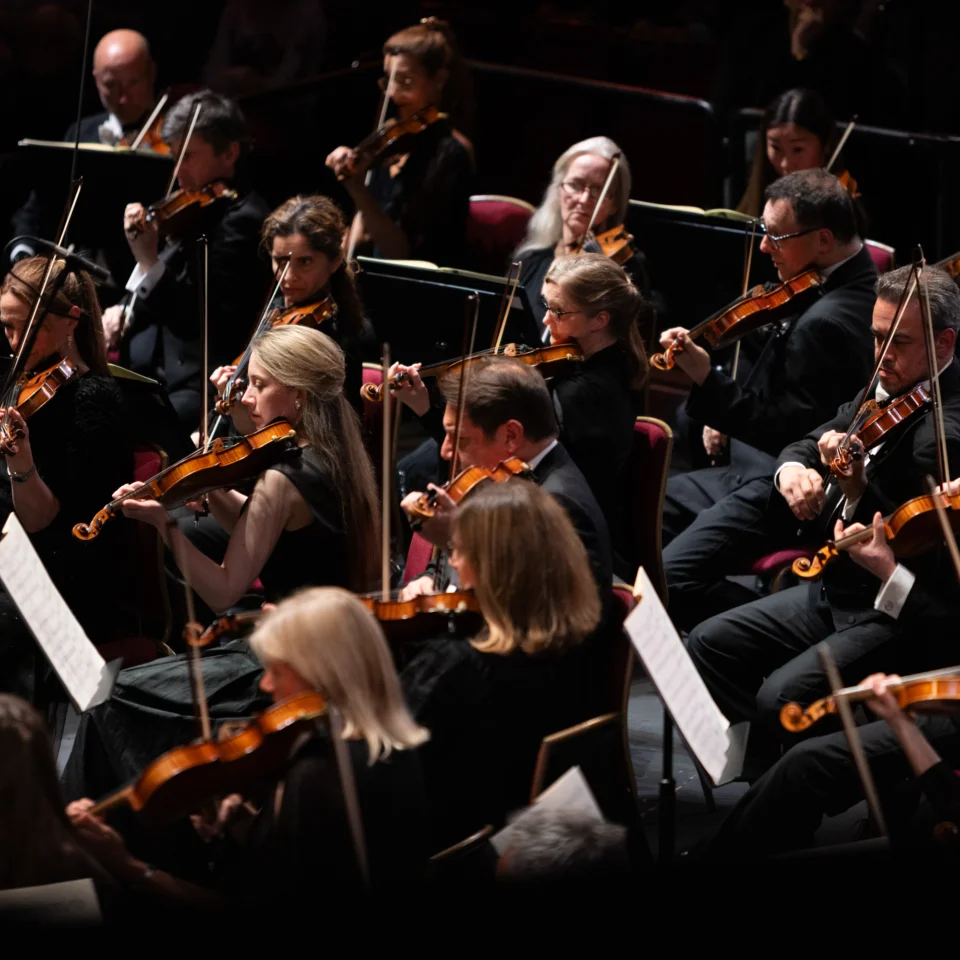 RPO violinists and violists performing on stage