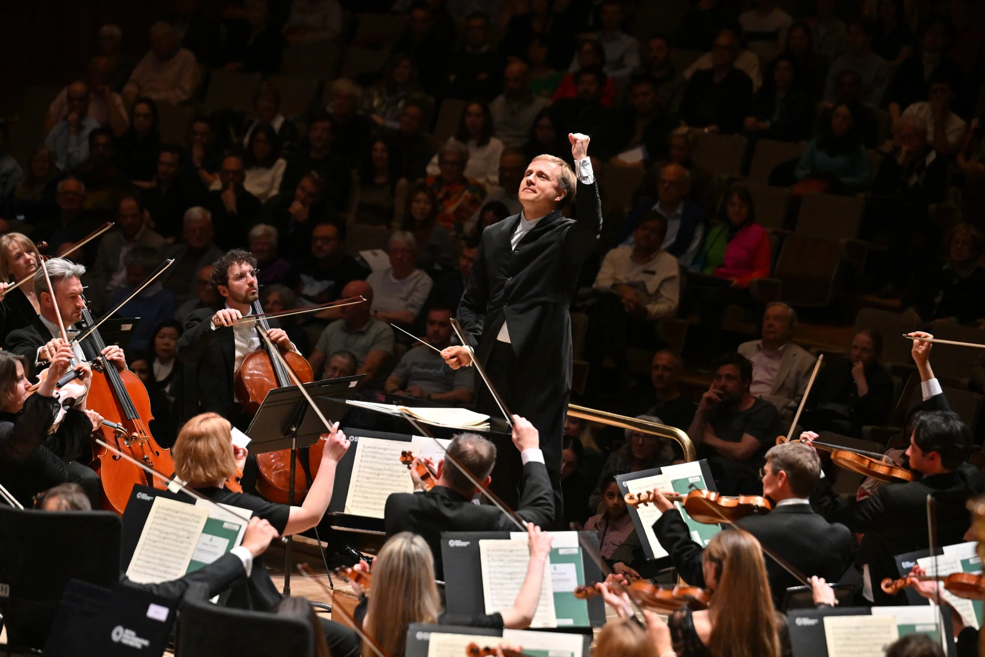 Vasily Petrenko conducting and raising his left fist in the air