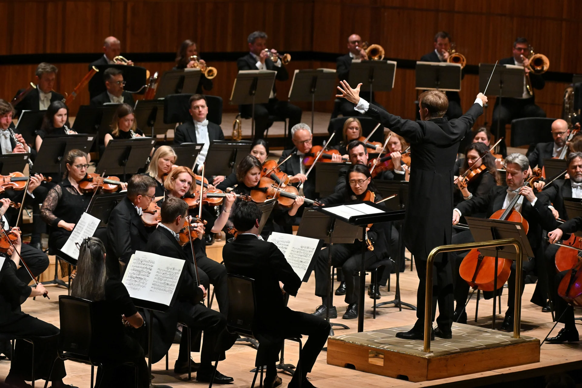 Vasily Petrenko conducting with his arms spread out