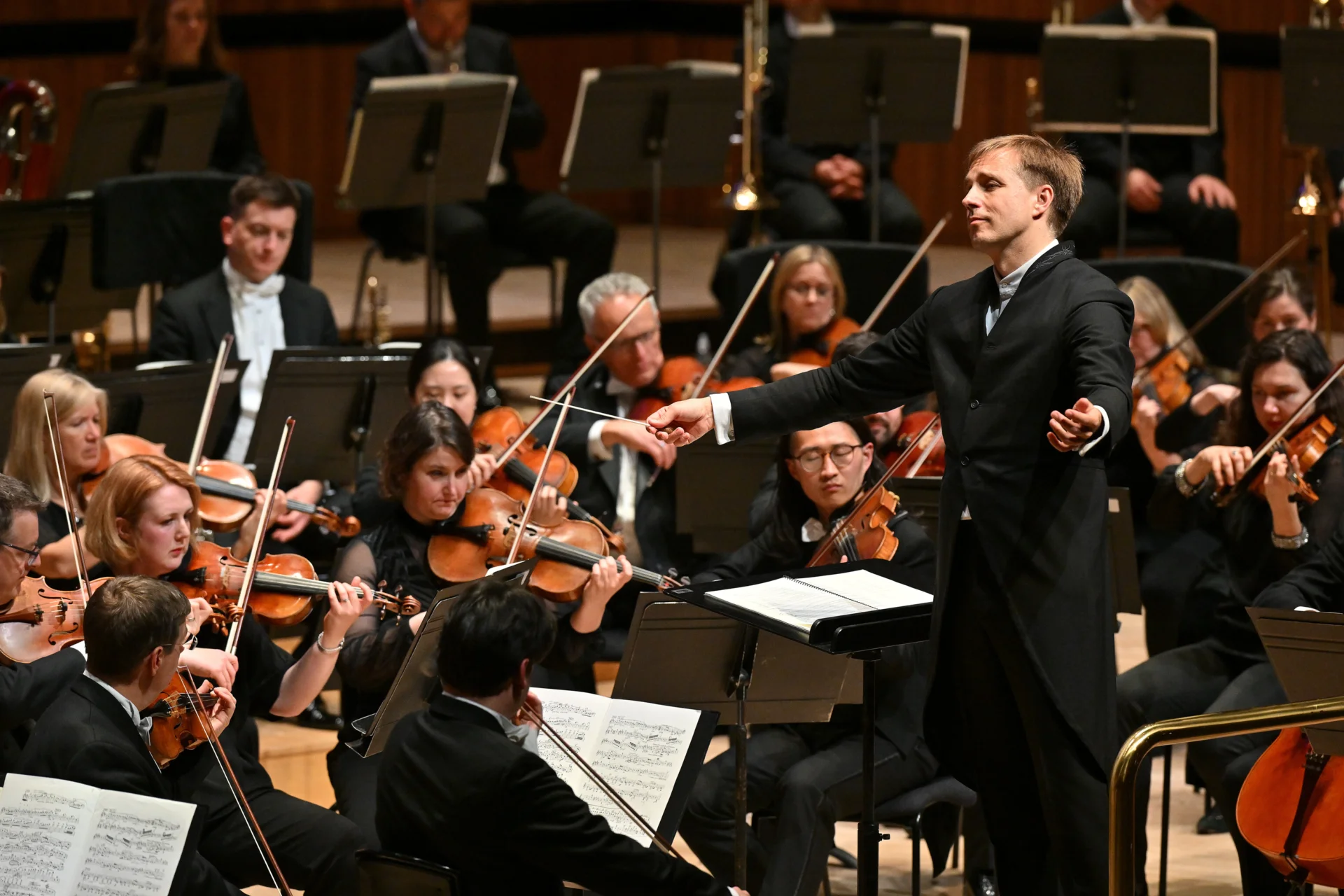Vasily Petrenko conducting and looking towards the first violins