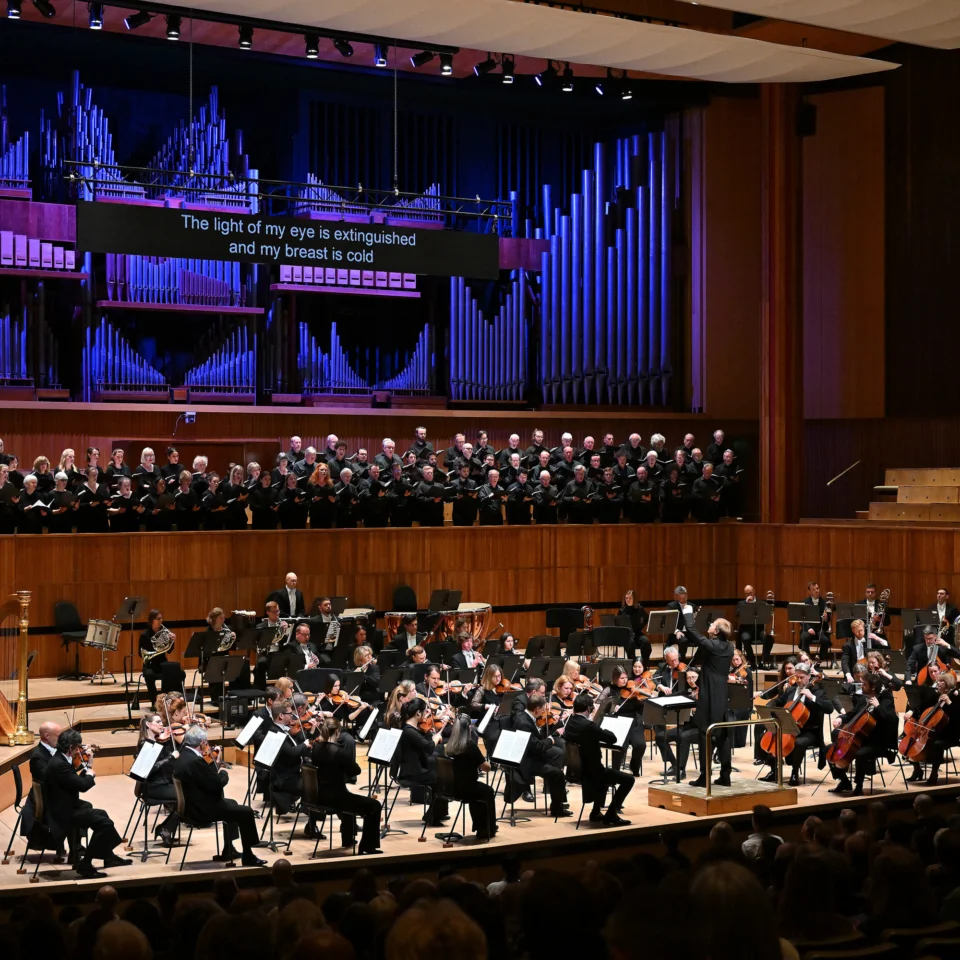 The Royal Philharmonic Orchestra and Philharmonia Chorus performing on stage