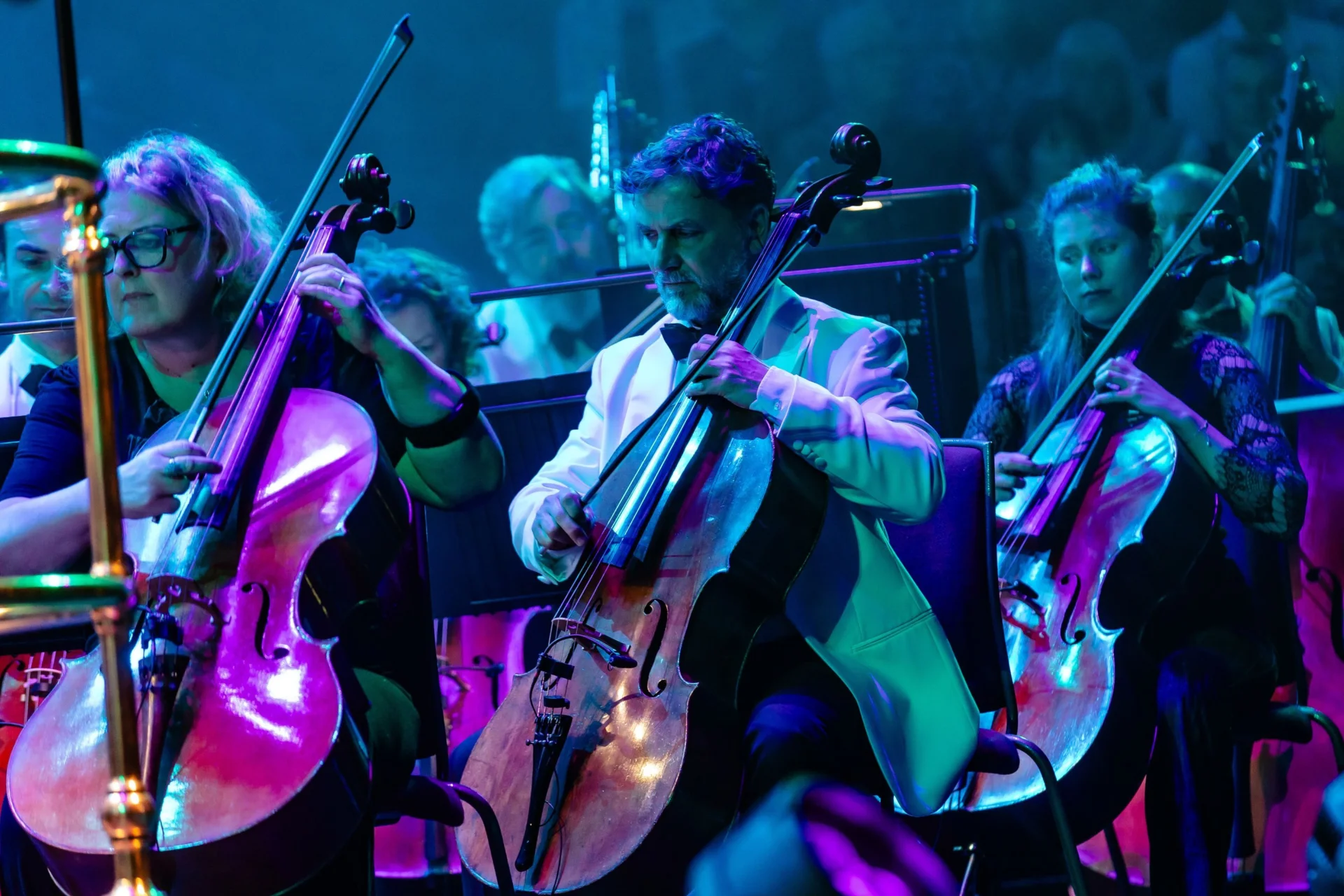 Close up shot of three cellists performing the Symphonic Groove concert