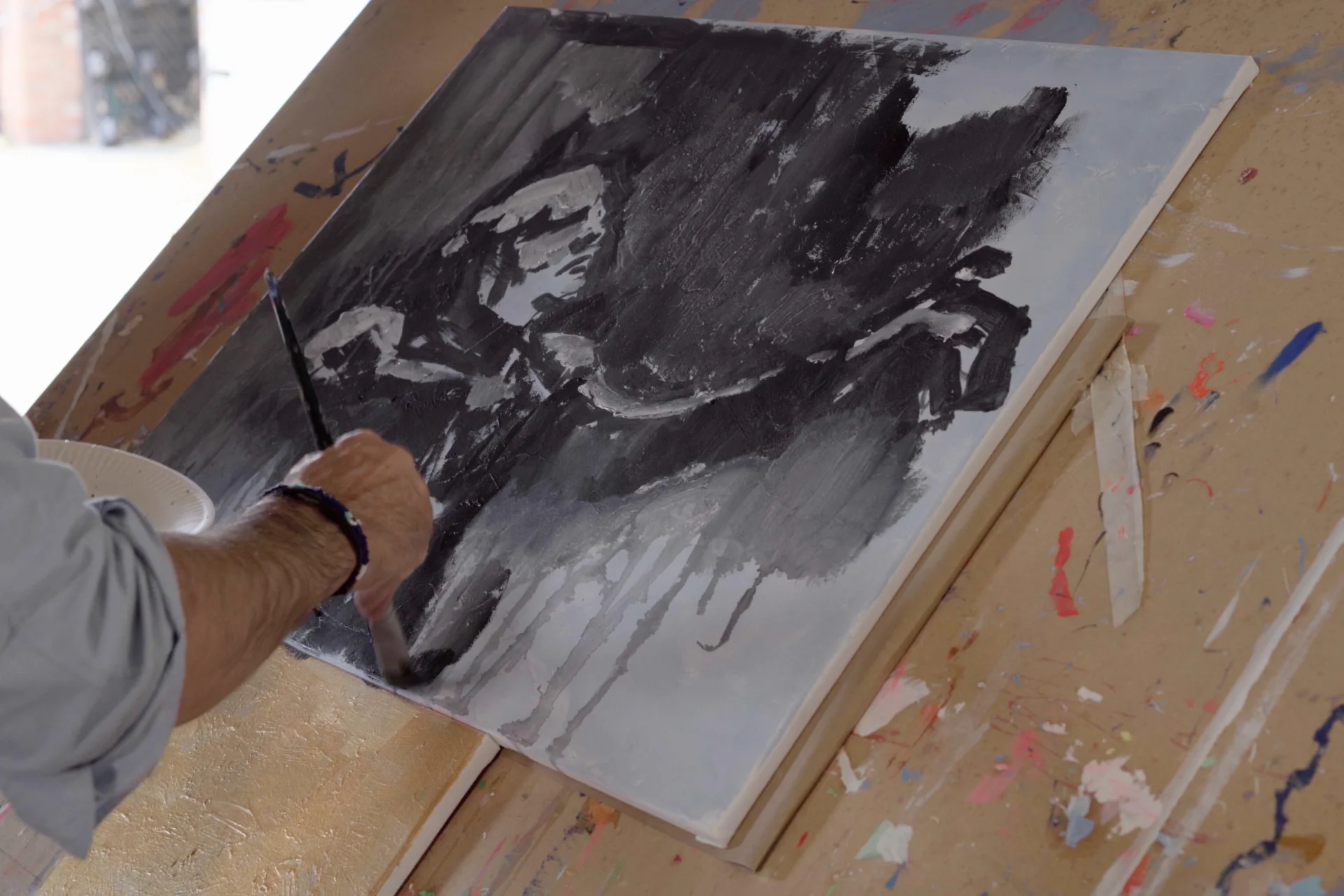 Black and white painting on an easel