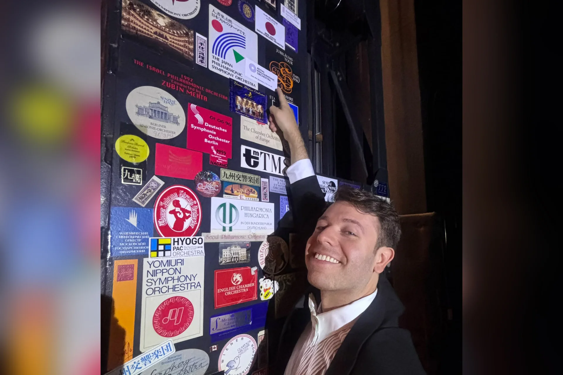 A player pointing at an RPO sticker backstage