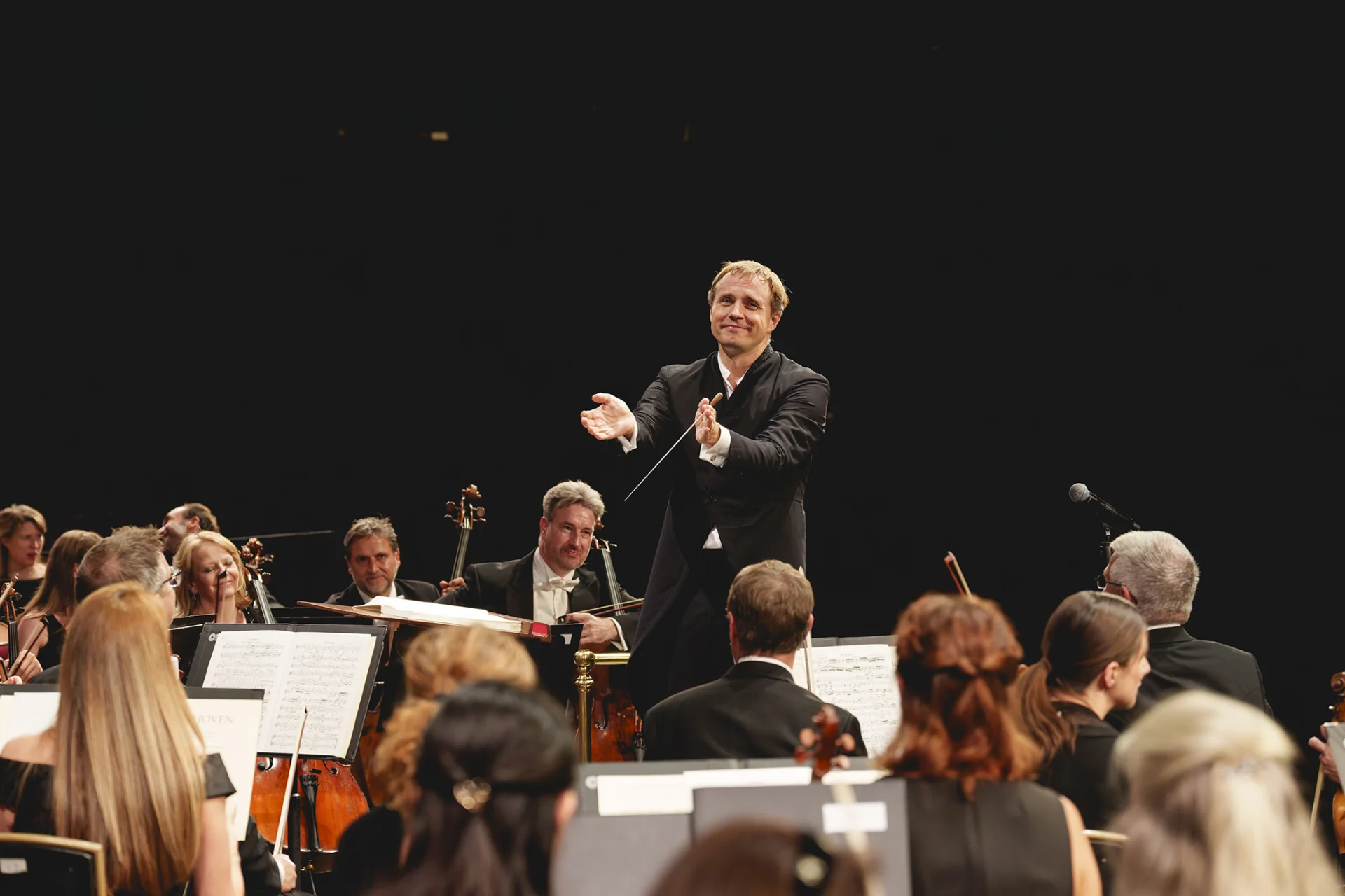 Vasily Petrenko applauding the Royal Philharmonic Orchestra