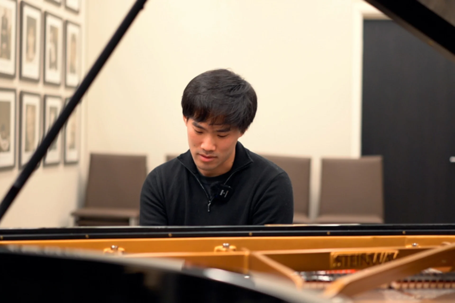 Bruce Liu sitting at a piano