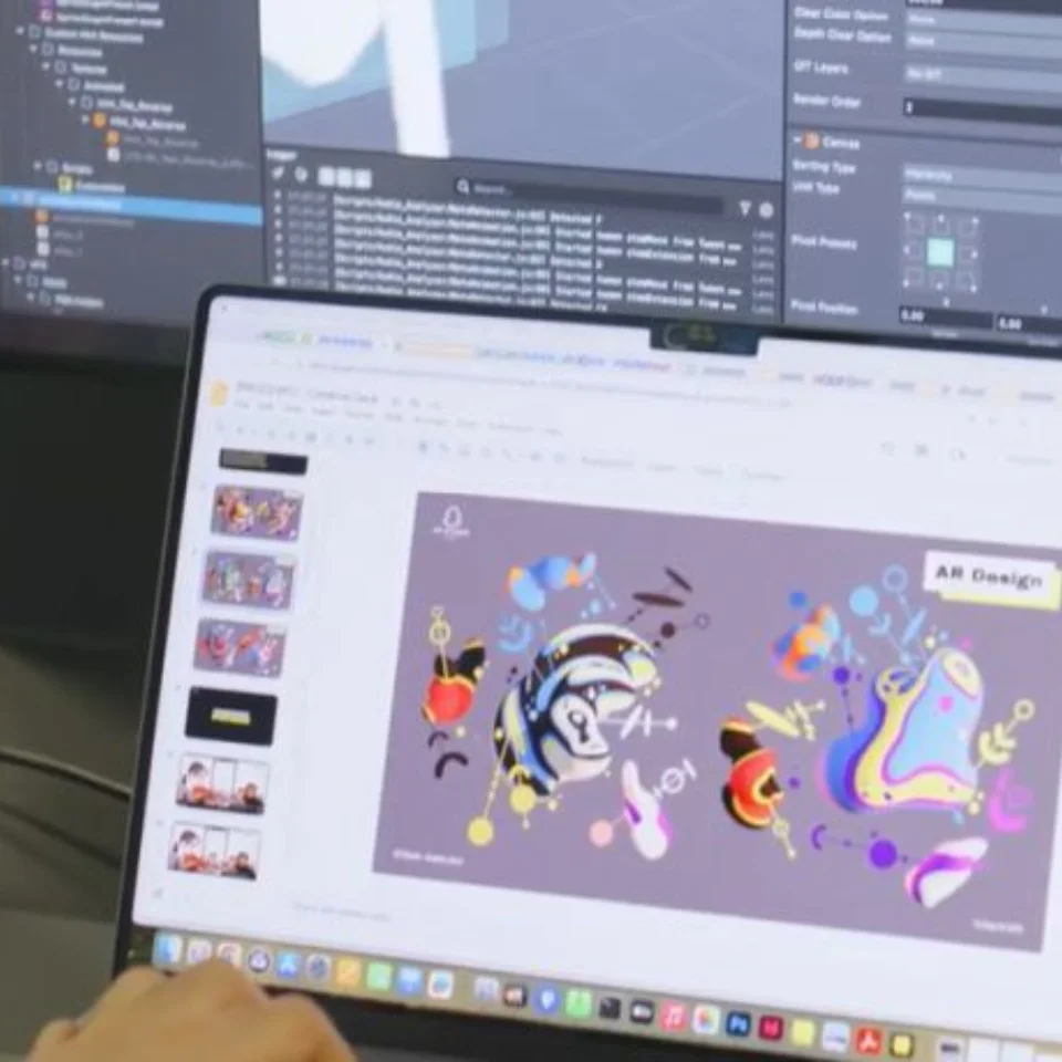 A computer screen showing the AR design for The Colours of Music can be seen