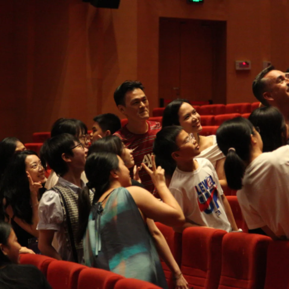 RPO Principal Contrabassoon Fraser Gordon taking a selfie with audience members and Ray Chen