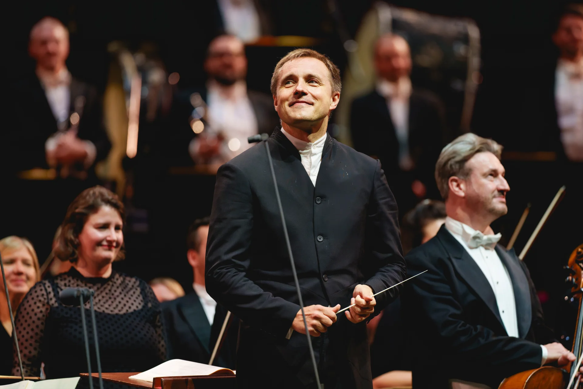 Vasily Petrenko smiling as he and the Orchestra receive applause at the Royal Albert Hall