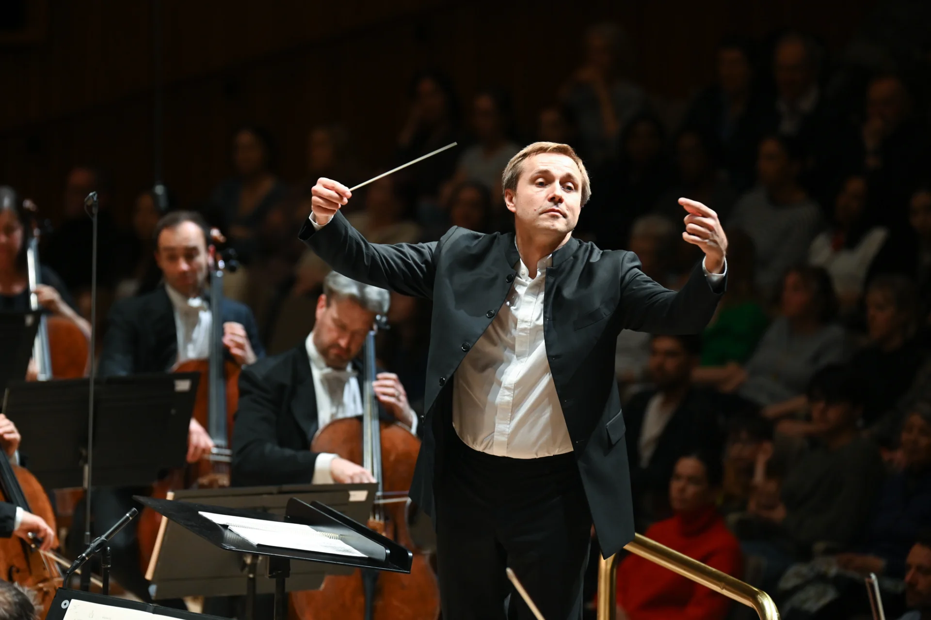 Vasily Petrenko is shown conducting with his arms up on stage the Royal Festival Hall
