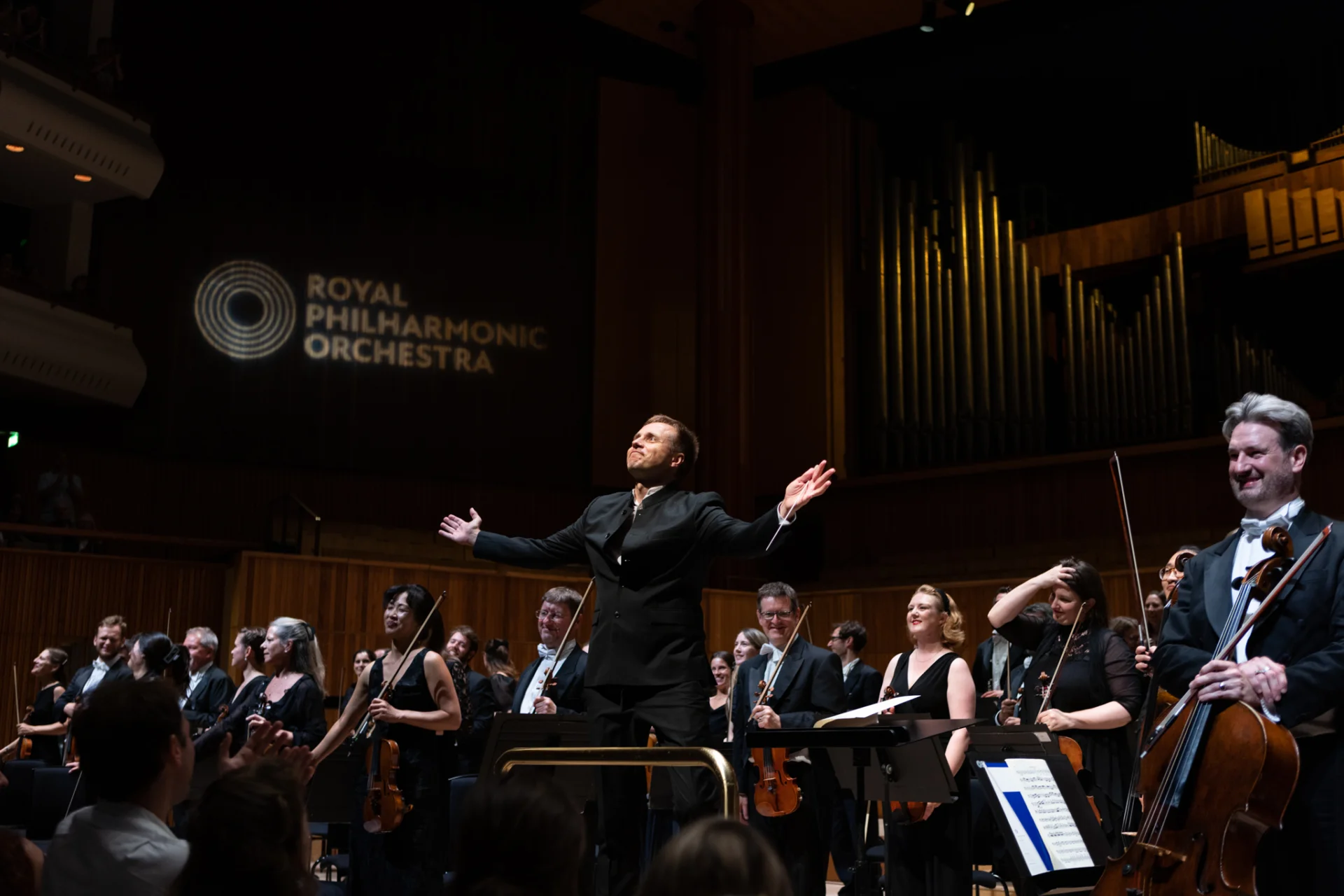 Vasily Petrenko and the Orchestra receiving applause on stage