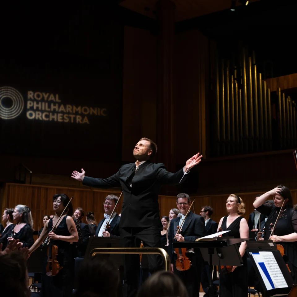 Vasily Petrenko and the Orchestra receiving applause on stage
