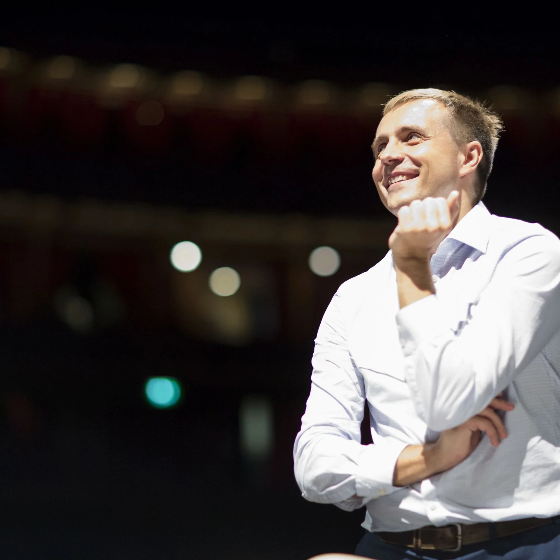 Vasily smiles in a rehearsal.