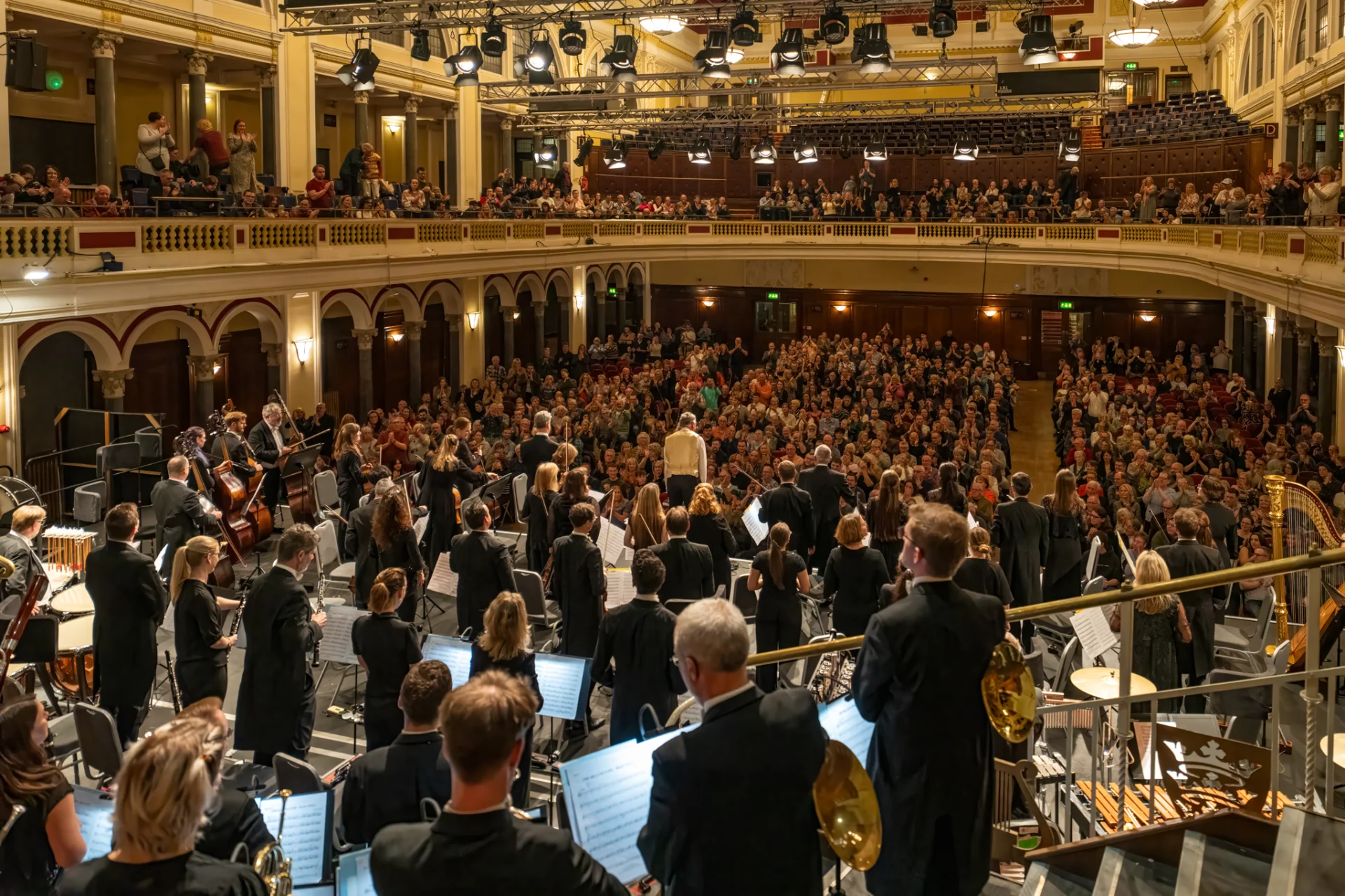 Image of the Royal Philharmonic Orchestra on stage at Hull City Hall, receiving applause