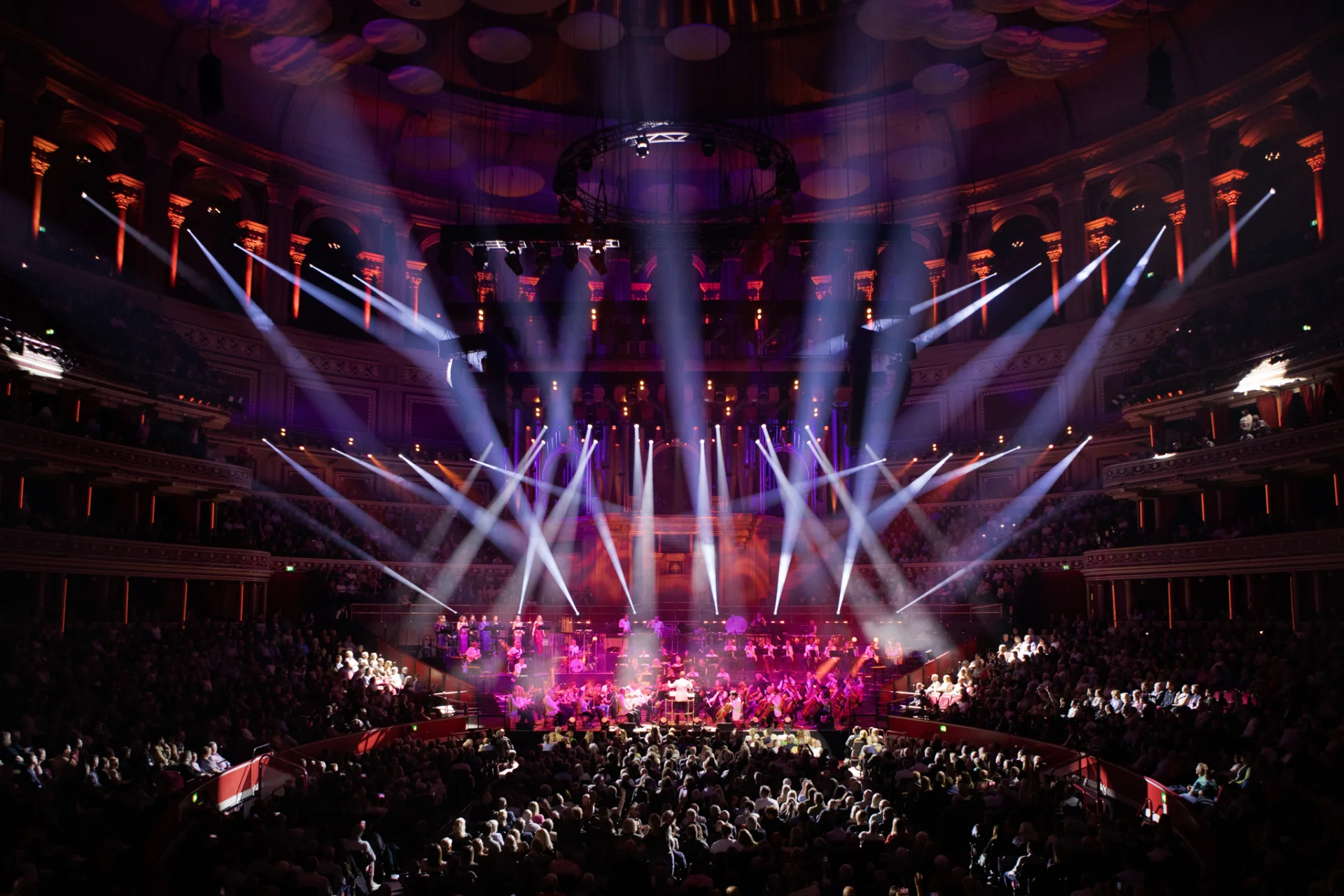 RPO on stage to sold-out audience at Royal Albert Hall with laser lighting illuminating the stage