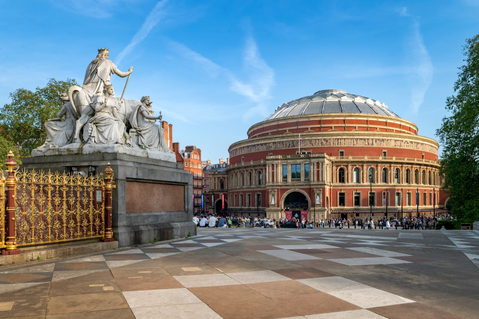 Exterior of the Royal Albert Hall on a sunny day with blue sky