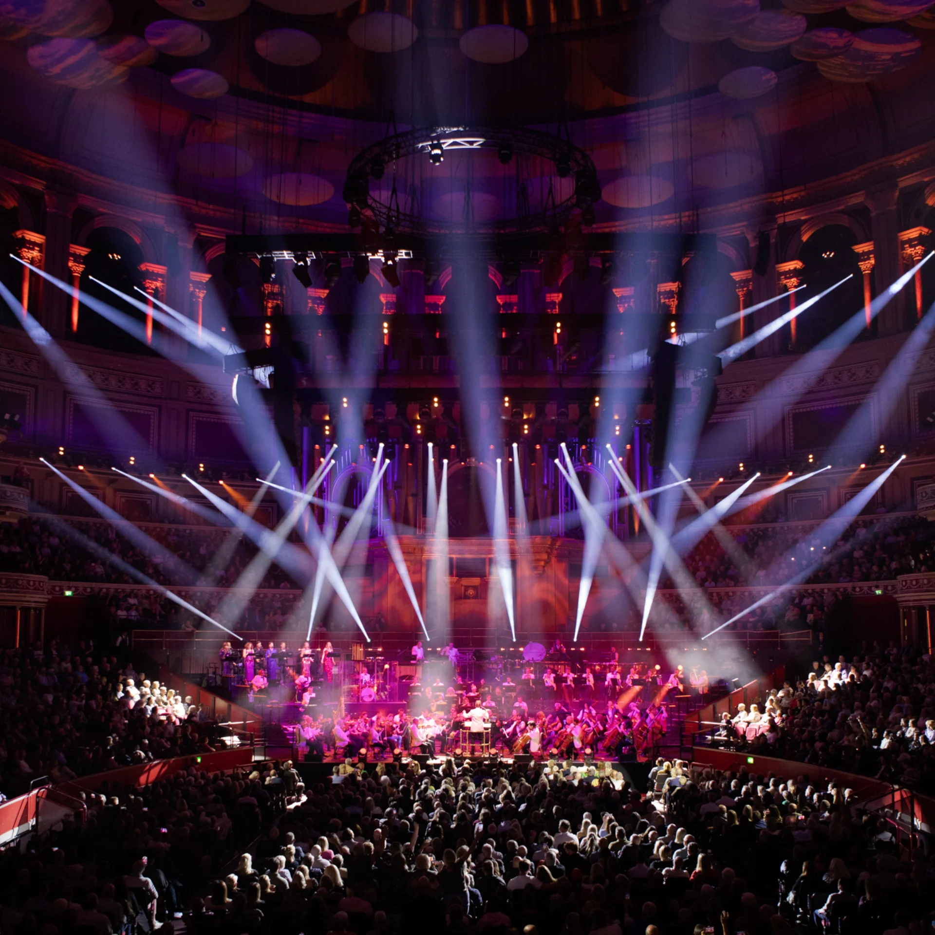 RPO on stage to sold-out audience at Royal Albert Hall with laser lighting illuminating the stage