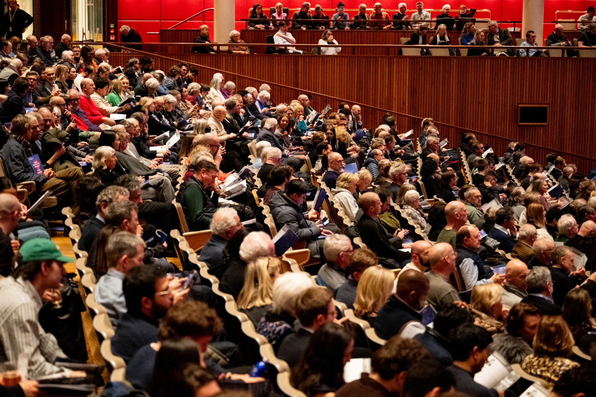 Audience members seated at the Royal Festival Hall before a concert