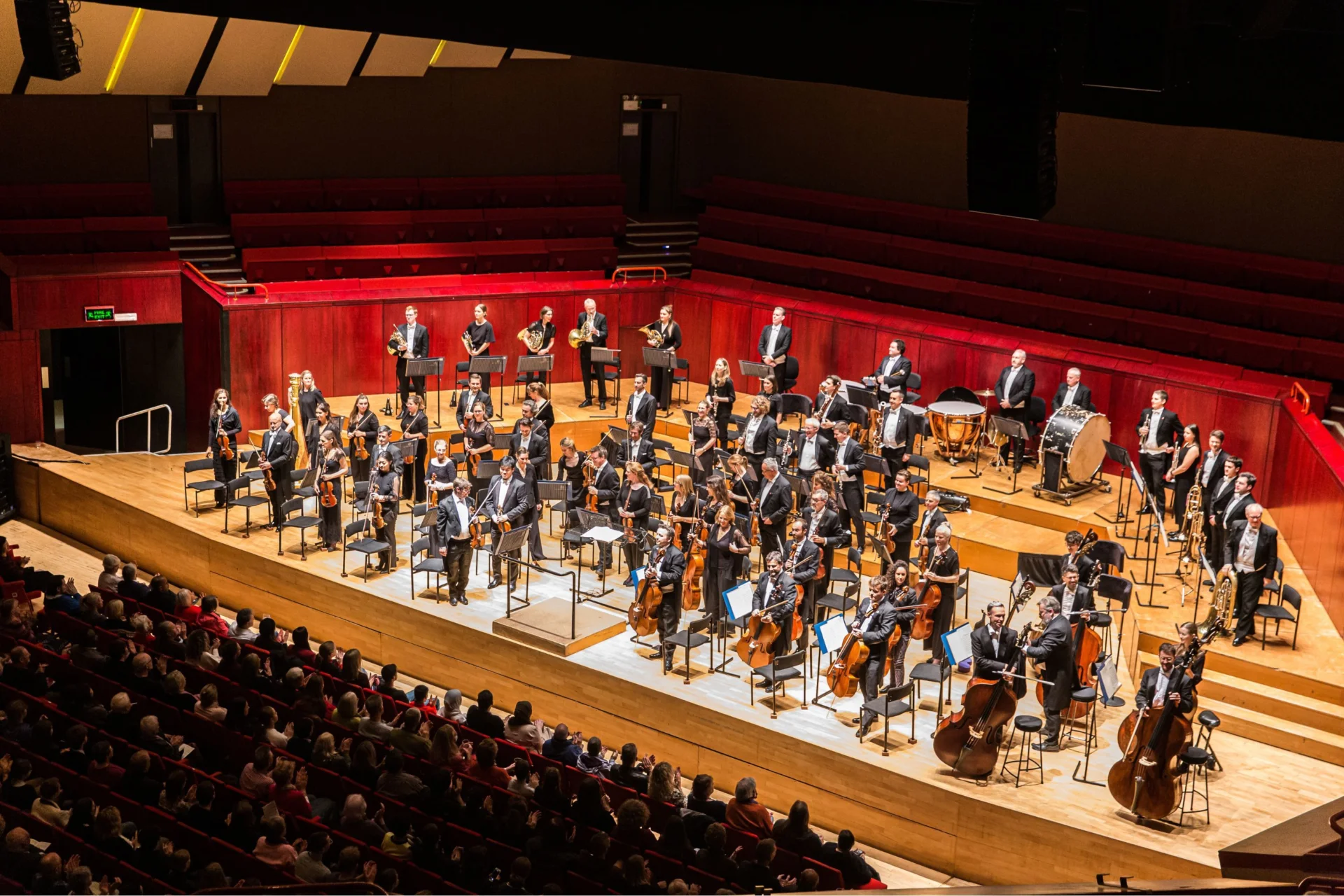 The Royal Philharmonic Orchestra stands for applause at The Hexagon