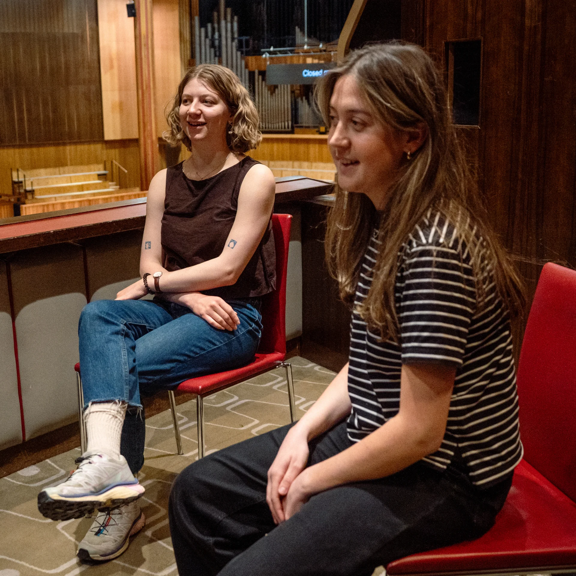 RPO players Zoe Tweed and Ruby Collins in a box at the Royal Festival Hall talking to Jeremy