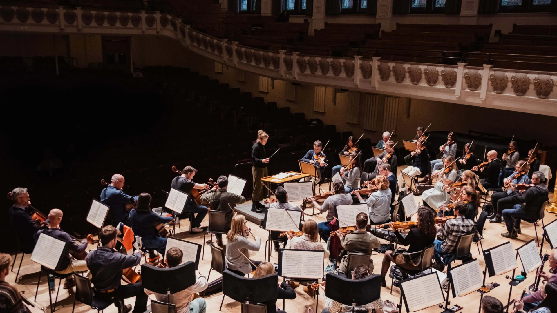 Conductor Charlotte Corderoy rehearsing wit the Orchestra at Cadogan Hall