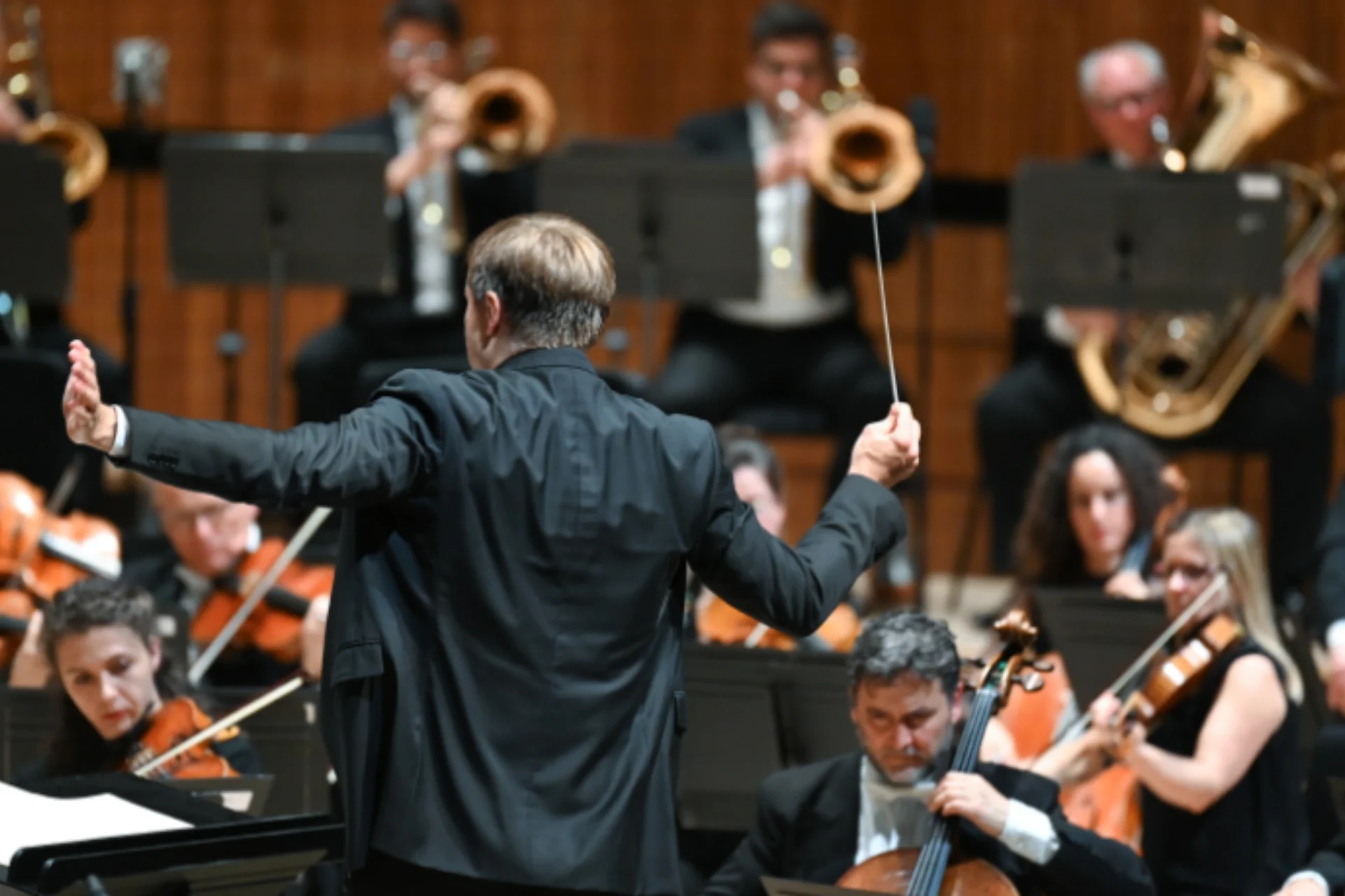 Conductor conducting an orchestra